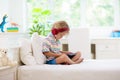 Child with tablet computer. Kids study online Royalty Free Stock Photo