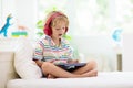 Child with tablet computer. Kids study online Royalty Free Stock Photo