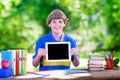 Child with tablet computer on school yard Royalty Free Stock Photo