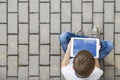 Child with tablet computer sitting outdoors. Education, learning, technology, friends, school concept. Top view. Royalty Free Stock Photo