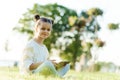 Child with tablet pc outdoors. Little girl on grass with computer Royalty Free Stock Photo