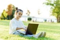 Child with tablet pc outdoors. Little girl on grass with computer Royalty Free Stock Photo