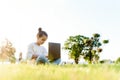 Child with tablet pc outdoors. Little girl on grass with computer Royalty Free Stock Photo