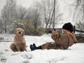 The child takes pictures of the dog.