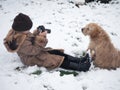 The child takes pictures of the dog