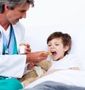 Child taking cough medicine Royalty Free Stock Photo