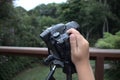 child taking nature photograph