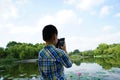 A child is concentrated on taking photoes Royalty Free Stock Photo