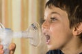Child taking respiratory, inhalation therapy Royalty Free Stock Photo