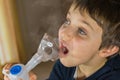 child taking respiratory, inhalation therapy