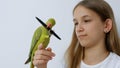 Child Talk Parrot, Happy Kid Playing her Pet, Girl Plays Bird at Home, Funny Indian Ring-Necked Parakeet Birds Cage Family