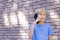 Child talking on mobile phone. People, technology and communication concept. Royalty Free Stock Photo