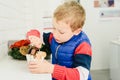 Child tasting an ice cream and eating it with childish cravings