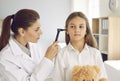 Otolaryngologist doing ENT examination of child during medical checkup at her office Royalty Free Stock Photo