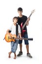 Child and teenager with guitar and bass