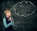 Child Thinking Bubble over Blackboard Background, School Boy