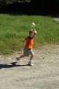 Child throwing a ball