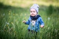 Kid toddler in grass, happy expression Royalty Free Stock Photo