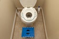 A child toilet seat attachment placed on top of a toilet for a kid during potty training Royalty Free Stock Photo