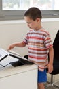 Child touching touch screen computer