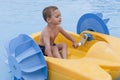 Child on toy boat Royalty Free Stock Photo