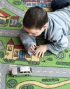 Child with toy car