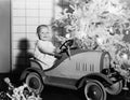 Child with toy car under Christmas tree Royalty Free Stock Photo