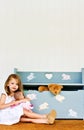 Child with toy chest Royalty Free Stock Photo