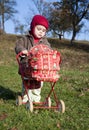 Child with a toy pram