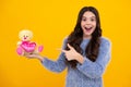 Child with toy teddy bear with love heart for valentines day. Amazed teenager. Teenager child girl in holding plush toy Royalty Free Stock Photo