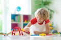 Child with toy train. Kids wooden railway Royalty Free Stock Photo