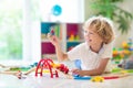 Child with toy train. Kids wooden railway Royalty Free Stock Photo