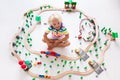 Child with toy train. Kids wooden railway. Royalty Free Stock Photo