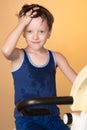 The child is trained on a stationary bike . Healthy lifestyle. Royalty Free Stock Photo