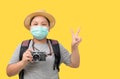 Child traveler wear surgical mask holding vintage camera