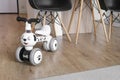 Child tricycle balance bike in the living room. Modern interior. Children and renovation Royalty Free Stock Photo