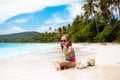 Child on tropical beach. Kid with sea shell Royalty Free Stock Photo