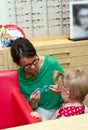 Child trying on eyeglasses