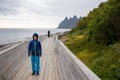 Child in Tungeneset, Senja, Norway, enjoying the beautiful view