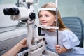 Child undergoing ophthalmic examination at eye clinic done by optometrist Royalty Free Stock Photo