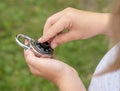 Child unlocking a simple closed coded lock, holding a code padlock in hands. Password cracking, encryption and decryption, hacking