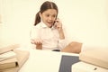 Child use smartphone mobile to communicate in school. Fresh school gossip. She like talking too much. Discussing rumors