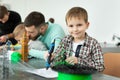 Child using 3D printing pen. Boy making new item. Creative, technology, leisure, education concept. Royalty Free Stock Photo