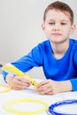 Child using 3D printing pen. Creative, technology, leisure, education concept Royalty Free Stock Photo