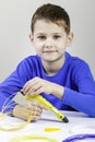 Child using 3D printing pen. Creative, technology, leisure, education concept Royalty Free Stock Photo