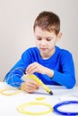 Child using 3d printing pen. Creative, technology, leisure, education concept Royalty Free Stock Photo