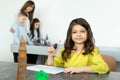 Child using 3D printing pen. Girl making new item. Creative, technology, leisure, education concept. Royalty Free Stock Photo