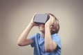 Child using new Virtual Reality, VR cardboard glasses Royalty Free Stock Photo