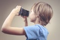 Child using new VR cardboard glasses Royalty Free Stock Photo