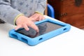 Child using a tablet touch screen device